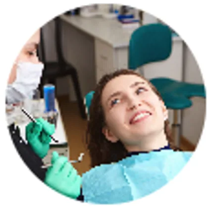 Patient smiling in the dental chair after treatment